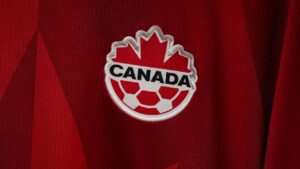 A Canada Soccer logo is seen on a jersey displayed in one of the team dressing rooms at B.C. Place stadium during a tour ahead of the FIFA World Cup, in Vancouver, on Monday, June 8, 2026. (Darryl Dyck/THE CANADIAN PRESS)