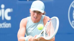 Poland's Iga Swiatek hits a return to Switzerland's Viktorija Golubic during National Bank Open action in Toronto on Thursday, August 6, 2026. (Chris Young/THE CANADIAN PRESS)
