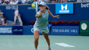 Poland's Iga Swiatek reaches for the return to Kazakhstan's Elena Rybakina during National Bank Open final tennis action, in Toronto, Thursday, Aug. 13, 2026. (Chris Young/CP)