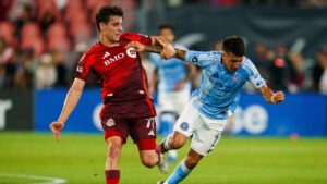 New York City FC's Nicolas Fernandez (7) is tripped by Toronto FC's Markus Cimermancic (71) during first half MLS soccer action in Toronto, on Saturday, Aug. 29, 2026. (Keito Newman/CP)