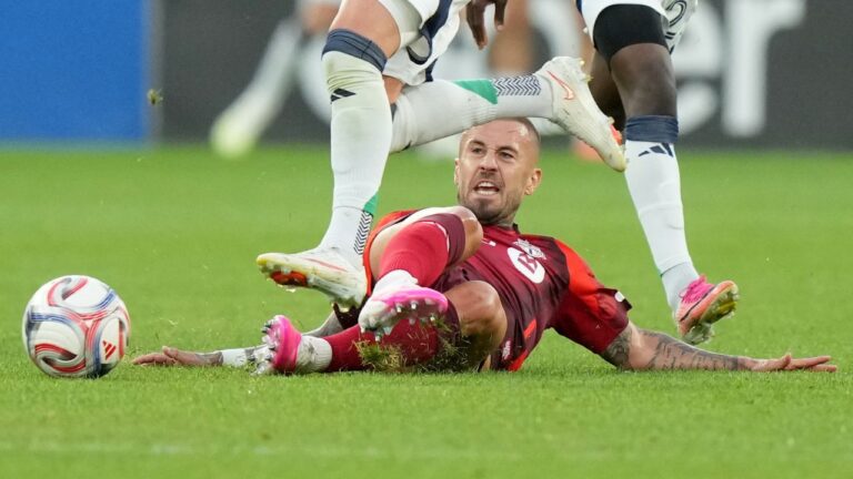 Toronto FC midfielder Niklas Dorsch (6) gets tripped up by New England Revolution midfielder Brooklyn Raines during first half MLS soccer action in Toronto, Saturday, Aug. 15, 2026. (Nathan Denette/CP)