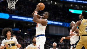 New York Knicks forward Trey Jemison III grabs a rebound during the second half of an NBA basketball game against the Washington Wizards, Tuesday, Feb. 3, 2026, in Washington. (John McDonnell/AP)