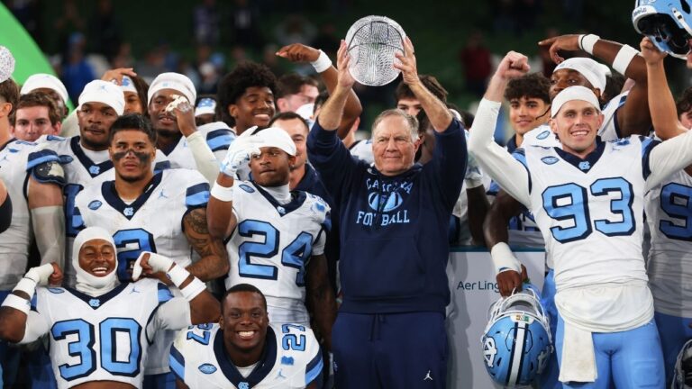 North Carolina head coach Bill Belichick and his team celebrate after defeating TCU in an NCAA college football game in Dublin, Ireland, Saturday, Aug. 29, 2026. (Peter Morrison/AP)
