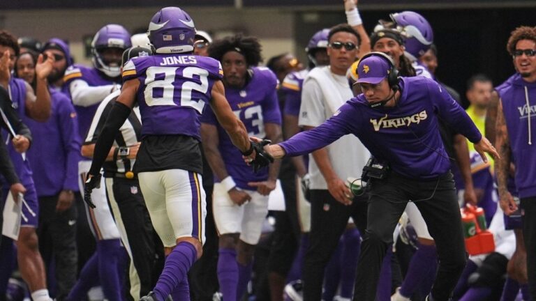 Minnesota Vikings wide receiver Jeshaun Jones (82) celebrates with head coach Kevin O'Connell after completing a 35-yard catch during the first half of an NFL pre-season football game against the Baltimore Ravens, Saturday, Aug. 22, 2026, in Minneapolis. (Abbie Parr/AP)