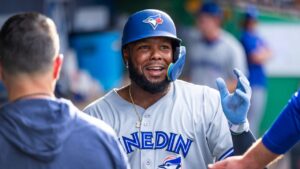 Vladimir Guerrero Jr. celebrates in the dugout with the Dunedin Blue Jays. (Photo credit: Dunedin Blue Jays)