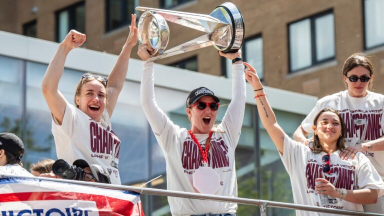 Montreal Victoire goaltender Ann-Renee Desbiens hoists the Walter Cup while surrounded by teammates, during Montreal Victoire's victory celebration in Montreal, on Saturday, May 30, 2026. (Christopher Katsarov/THE CANADIAN PRESS)