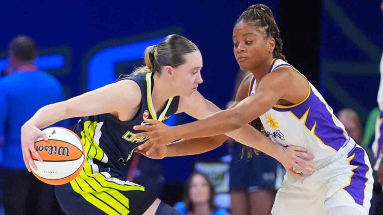 Dallas Wings guard Paige Bueckers, left, keeps the ball from Los Angeles Sparks forward Sania Feagin (1) during the first half of a WNBA basketball game in Arlington, Texas, Thursday, Sept. 17, 2026. (LM Otero/AP)