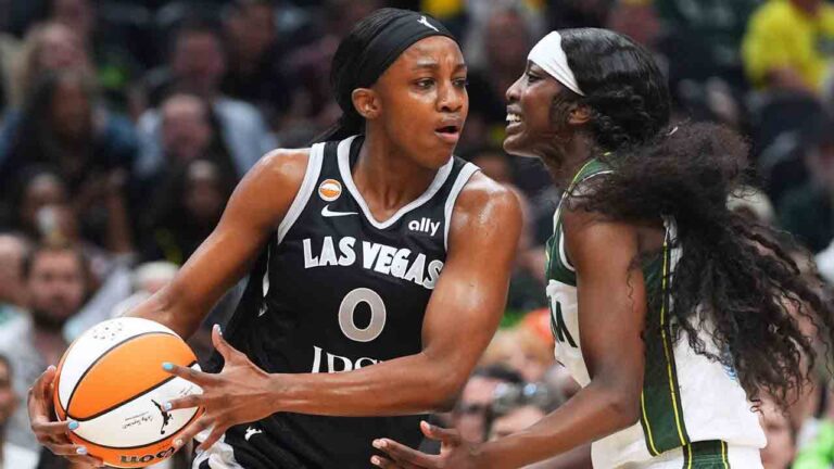 Las Vegas Aces guard Jackie Young, left, looks around the defense of Seattle Storm guard Flau'jae Johnson, right, during the first half of a WNBA basketball game, Thursday, Sept. 17, 2026, in Seattle. (Lindsey Wasson/AP)