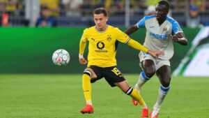 Villarreal's Pape Gueye, right, and Dortmund's Konstantinos Karetsas challenge for the ball during the Champions League opening phase soccer match between Borussia Dortmund and Villarreal in Dortmund, Germany, Tuesday, Sept. 8, 2026. (Martin Meissner/AP)