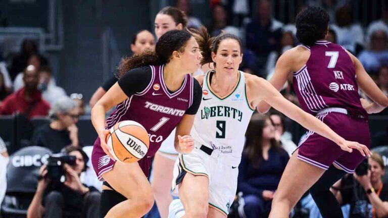 Toronto Tempo's Kiki Rice (1) drives past New York Liberty's Rebecca Allen (9) during first half WNBA basketball action in Toronto, on Sunday, Sept. 20, 2026. (Sammy Kogan/CP)