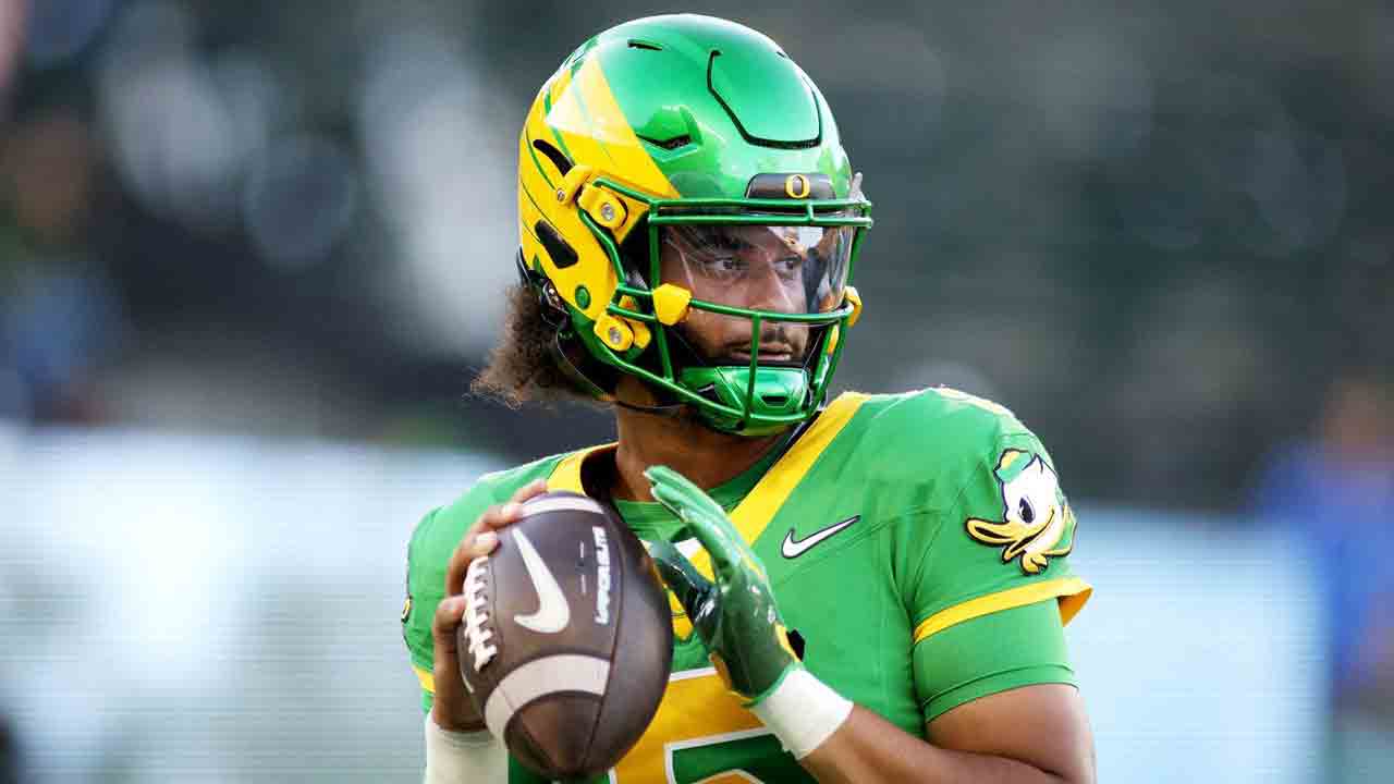 Oregon QB Dante Moore leaves field on cart, in neck brace after late hit