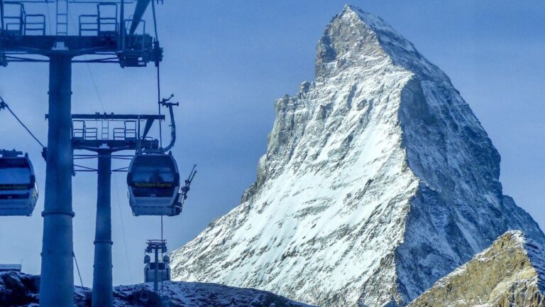 Gondolas go up next to the Matterhorn in Zermatt, Switzerland, Thursday, Dec.3, 2020. (AP Photo/Jamey Keaten)