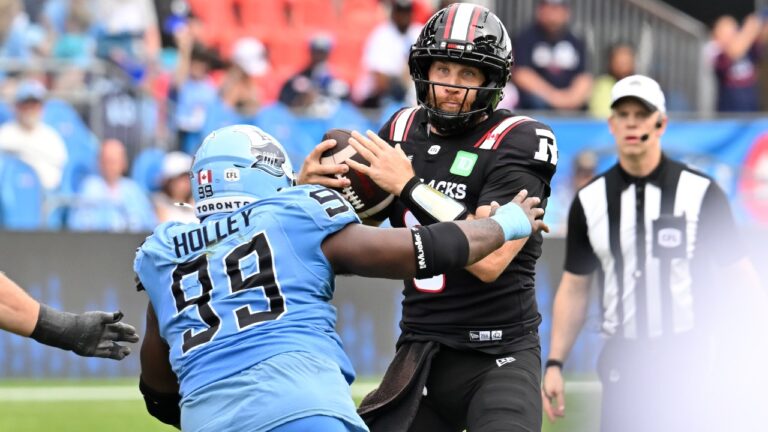 Ottawa Redblacks quarterback McLeod Bethel-Thompson (3) is sacked by Toronto Argos defensive tackle Ralph Holley (99) during second half CFL football action in Toronto on Saturday, Sept. 12, 2026. (Jon Blacker/CP)