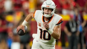 Denver Broncos quarterback Bo Nix scrambles during the second half of an NFL football game against the Kansas City Chiefs, Monday, Sept. 14, 2026, in Kansas City, Mo. (Charlie Riedel/AP)