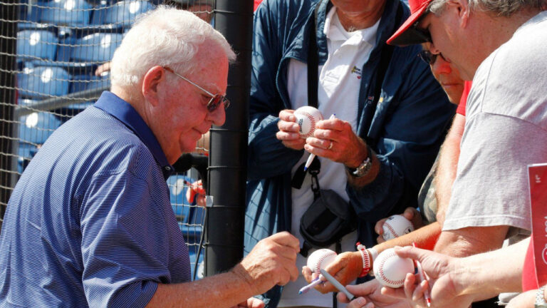 Philadelphia Phillies chairman Bill Giles signs autographs before a spring training baseball game in Clearwater, Fla., Monday, March 21, 2011. (Gene J. Puskar/AP)