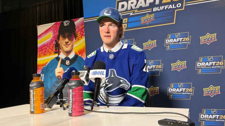 Brooks Rogowski addresses reporters after being selected by the Vancouver Canucks with the first pick in the second round of the NHL draft at the KeyBank Center. (John Wawrow/AP)