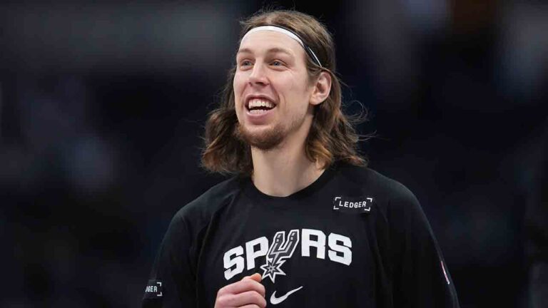 San Antonio Spurs center Kelly Olynyk (8) in the first half of an NBA basketball game Saturday, April 4, 2026, in Denver. (David Zalubowski/AP)