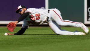 Baltimore Orioles center fielder Rece Hinds is unable to catch a fly ball hit by Cleveland Guardians' José Ramírez during the ninth inning of a baseball game, Monday, Sept. 7, 2026, in Baltimore. (AP Photo/Stephanie Scarbrough)