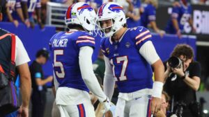 Buffalo Bills wide receiver Josh Palmer (5) and quarterback Josh Allen (17) celebrate their touchdown against the Detroit Lions during the first half of an NFL football game in Orchard Park, N.Y., Thursday, Sept. 17, 2026. (Jeffrey T. Barnes/AP)