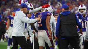 Buffalo Bills wide receiver DJ Moore (2) is helped off the field against the Detroit Lions during the first half of an NFL football game in Orchard Park, N.Y., Thursday, Sept. 17, 2026. (Jeffrey T. Barnes/AP)