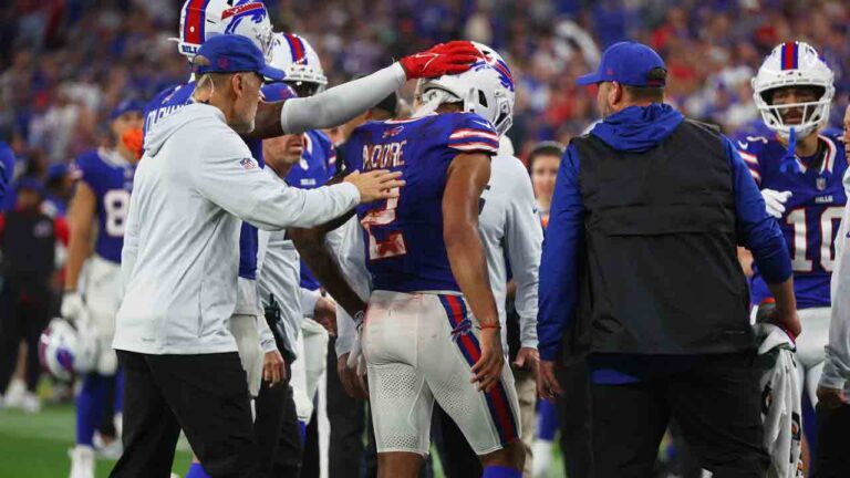 Buffalo Bills wide receiver DJ Moore (2) is helped off the field against the Detroit Lions during the first half of an NFL football game in Orchard Park, N.Y., Thursday, Sept. 17, 2026. (Jeffrey T. Barnes/AP)