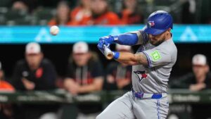 Toronto Blue Jays' Nathan Lukes hits an RBI single during the first inning of a baseball game against the Baltimore Orioles, Monday, Sept. 21, 2026, in Baltimore. (Stephanie Scarbrough/AP)