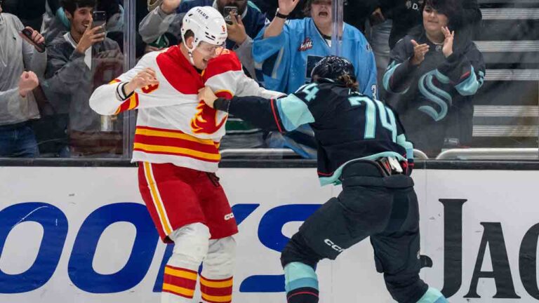 Calgary Flames defenceman Andreas Englund, left, and Seattle Kraken forward Bobby McMann fight during the second period of a pre-season NHL hockey game, Thursday, Sept. 24, 2026, in Seattle. (Stephen Brashear/AP)