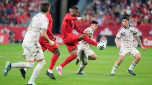 Canada's Cyle Larin brings the ball under control under pressure from Chile's defence during first half International friendly action, in Toronto, on Saturday, Sept. 26, 2026. (Chris Young/CP)