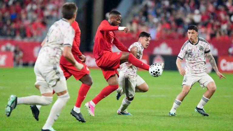 Canada's Cyle Larin brings the ball under control under pressure from Chile's defence during first half International friendly action, in Toronto, on Saturday, Sept. 26, 2026. (Chris Young/CP)