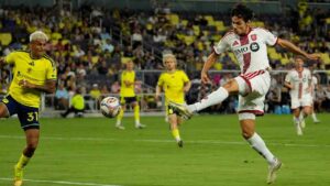Toronto FC forward Daniel Salloi, right, kicks the ball against Nashville SC defender Andy Najar (31) during the first half of an MLS soccer match Saturday, Sept. 26, 2026, in Nashville, Tenn. (AP Photo/George Walker IV)