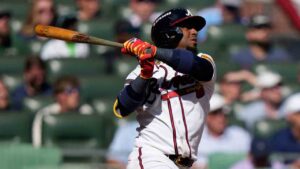 Atlanta Braves' Ozzie Albies hits a one-run triple against the Philadelphia Phillies in the sixth inning during Game 1 of baseball's National League Wild Card Series Tuesday, Sept. 29, 2026, in Atlanta. (Brynn Anderson/AP)