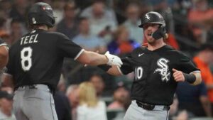 Chicago White Sox's Chase Meidroth (10) celebrates with Kyle Teel (8) after scoring off a 2-run single hit by by Sam Antonacci during the second inning in Game 1 of baseball's American League Wild Card Series against the Houston Astros, Tuesday, Sept. 29, 2026, in Houston. (Karen Warren/AP)