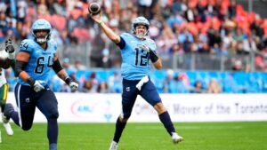 Toronto Argonauts quarterback Chad Kelly (12) throws a pass during first half CFL football action against the Edmonton Elks in Toronto on Saturday, Sept. 19, 2026. (Arlyn McAdorey/CP)