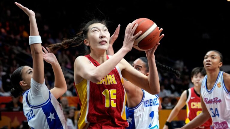 China's Han Xu, center, plays the ball during the Women's Basketball World Cup qualification playoff between Puerto Rico and China in Berlin, Wednesday, Sept. 9, 2026. (AP Photo/Ebrahim Noroozi)