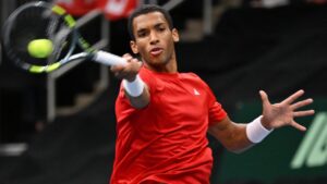 Canada's Felix Auger-Aliassime plays the ball to France's Arthur Rinderknech during the fourth match at the Davis Cup qualifier second round match at the Videotron Centre in Quebec City, Saturday, Sept. 19, 2026. (Jacques Boissinot/CP)