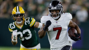 Atlanta Falcons' Bijan Robinson runs for a first down past Green Bay Packers' Evan Williams during the first half of an NFL football game in Green Bay, Wis., Thursday, Sept. 24, 2026. (Matt Ludtke/AP)