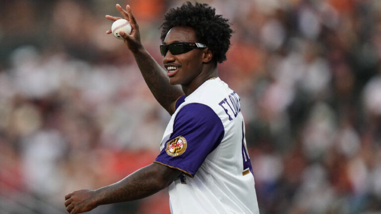 Baltimore Ravens NFL football wide receiver Zay Flowers waves to the crowd before throwing out a ceremonial first pitch ahead of a baseball game between the Baltimore Orioles and the Boston Red Sox, Saturday, Sept. 5, 2026, in Baltimore. (Stephanie Scarbrough/AP)