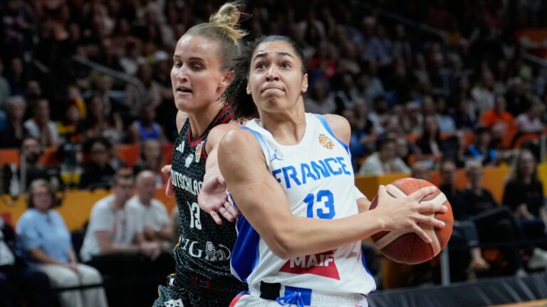 Germany's Leonie Fiebich guards France's Janelle Salaun during the Women's Basketball World Cup semifinal match between France and Germany in Berlin, Saturday, Sept. 12, 2026. (AP Photo/Ebrahim Noroozi)