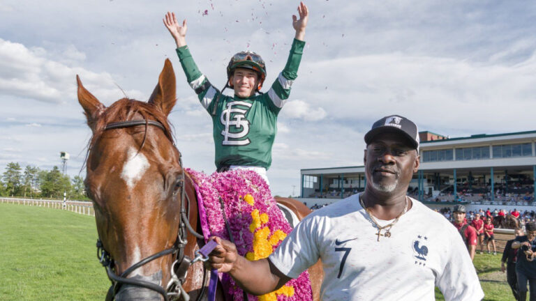Jockey Fraser Aebly, riding on top of Military Time, celebrates after taking the 91st Prince of Wales Stakes in Fort Erie, Ont., in a Monday, Sept. 7, 2026, handout photo. (Handout - Luke Edwards/CP)