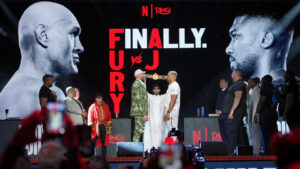 Tyson Fury, left, and Anthony Joshua, right, face off after a Press Conference in London, Wednesday, Sept. 30, 2026, to promote their upcoming fight which will take place at the Principality Stadium in Cardiff on Dec.11. (Kin Cheung/AP)