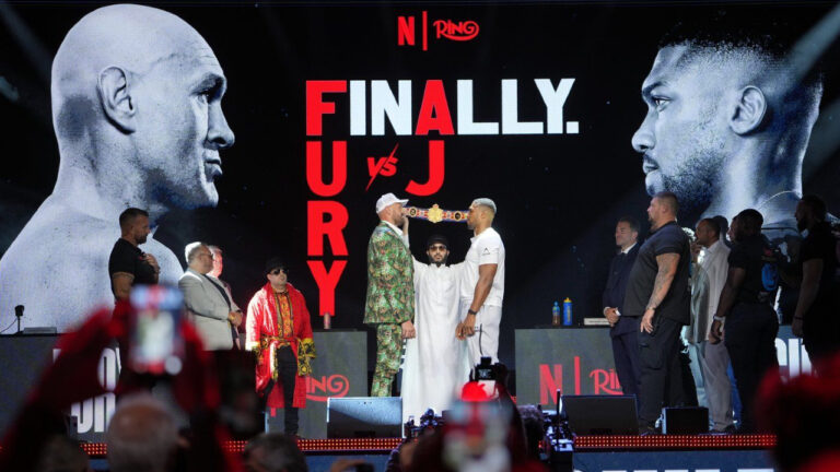 Tyson Fury, left, and Anthony Joshua, right, face off after a Press Conference in London, Wednesday, Sept. 30, 2026, to promote their upcoming fight which will take place at the Principality Stadium in Cardiff on Dec.11. (Kin Cheung/AP)