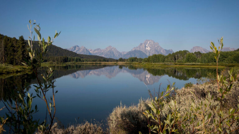 The Teton mountains reflect on Oxbow Bend in Grand Teton National Park in Moran, Wyo., Aug. 22, 2025. (Amber Baesler/AP)