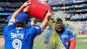 Toronto Blue Jays first baseman Vladimir Guerrero Jr., right, gets doused with Gatorade by Josh Smith (9) and Myles Straw after defeating the Baltimore Orioles during ninth inning American League MLB baseball action in Toronto on Sunday, Sept. 13, 2026. Vladimir Guerrero Jr. hit his first home run of the season at home and went four for five hits at bat. (Nathan Denette/CP)