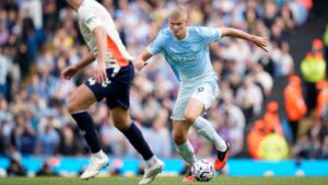 Manchester City's Erling Haaland, right, in action during the English Premier League soccer match between Manchester City and Coventry City in Manchester, England, Saturday, Sept. 5, 2026. (AP Photo/Dave Thompson)