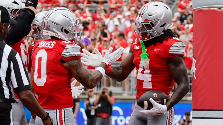 Ohio State wide receiver Jeremiah Smith, right, celebrates his touchdown reception against Ball State with teammate Brandon Inniss during the first half of an NCAA college football game, Saturday, Sept. 5, 2026, in Columbus, Ohio. (AP Photo/Jay LaPrete)