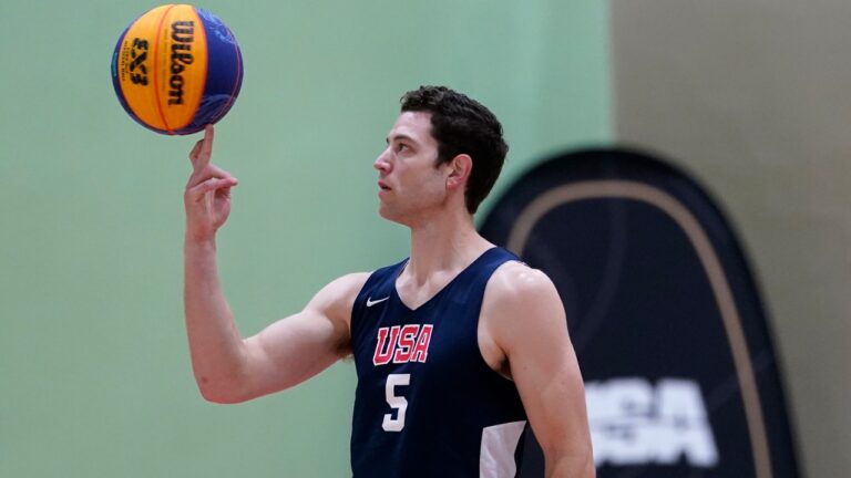 Jimmer Fredette spins the basketball during practice for the USA Basketball 3x3 national team, Monday, Oct. 31, 2022, in Miami Lakes, Fla. (AP Photo/Lynne Sladky)