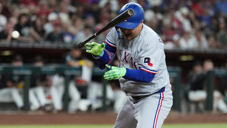 Texas Rangers designated hitter Joc Pederson reacts to being hit by a pitch against the Arizona Diamondbacks during the fifth inning of a baseball game, Saturday, Sept. 12, 2026, in Phoenix. (Ross D. Franklin/AP)