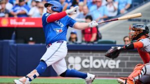 Toronto Blue Jays' Alejandro Kirk (30) hits an RBI single against the Baltimore Orioles during first inning MLB baseball action in Toronto, on Saturday, Sept. 12, 2026. (Sammy Kogan/CP)