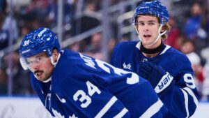Toronto Maple Leafs' Gavin McKenna (92), right, and Auston Matthews (34) look on during second period NHL pre-season hockey action against the Montreal Canadiens in Toronto, on Saturday, Sept. 19, 2026. (Sammy Kogan/CP)