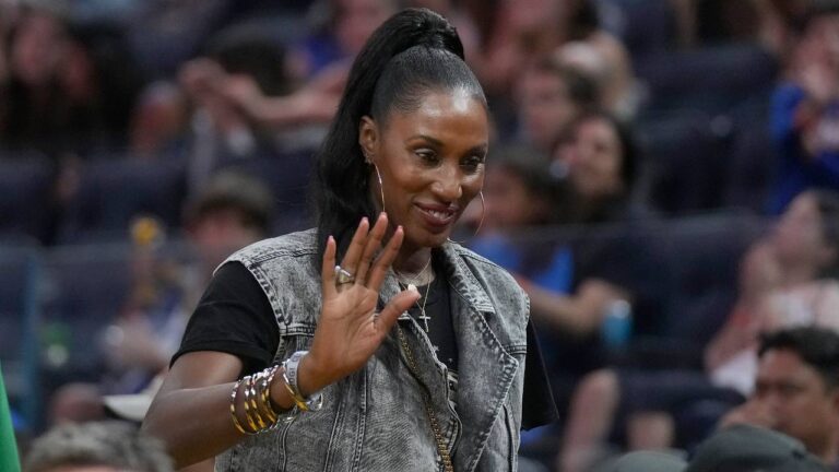 Lisa Leslie waves during an NBA preseason basketball game between the Golden State Warriors and the San Antonio Spurs in San Francisco, Friday, Oct. 20, 2023. (Jeff Chiu/AP)